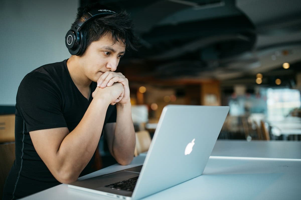 Student concentrating while studying on a laptop